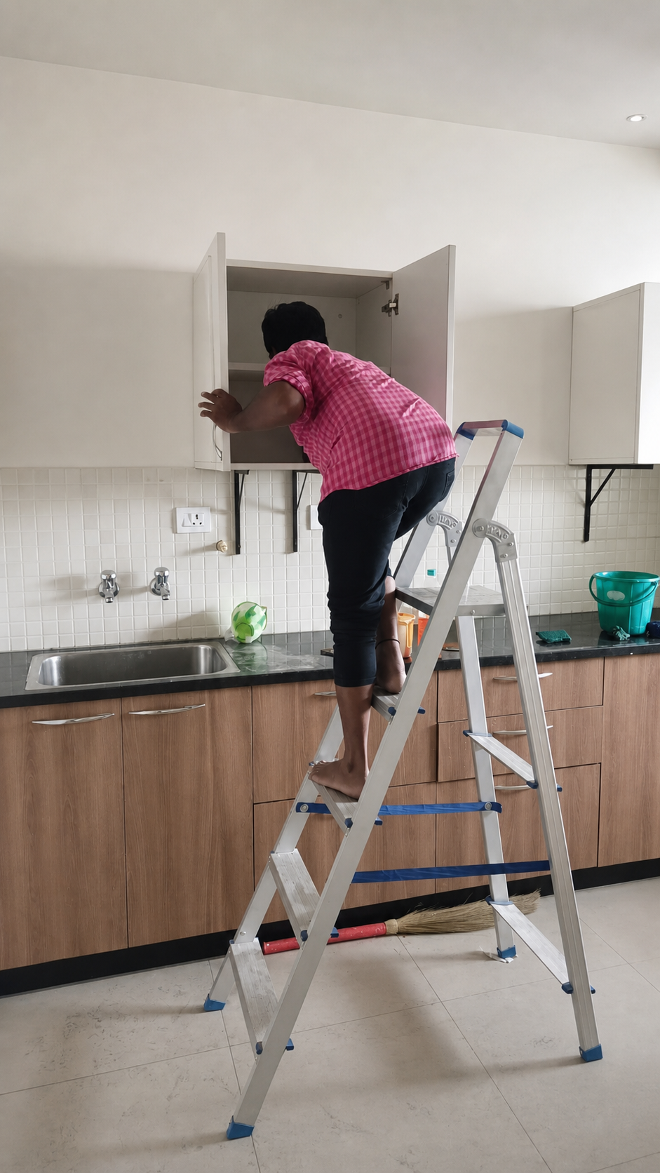 Kitchen cabinet cleaning in progress